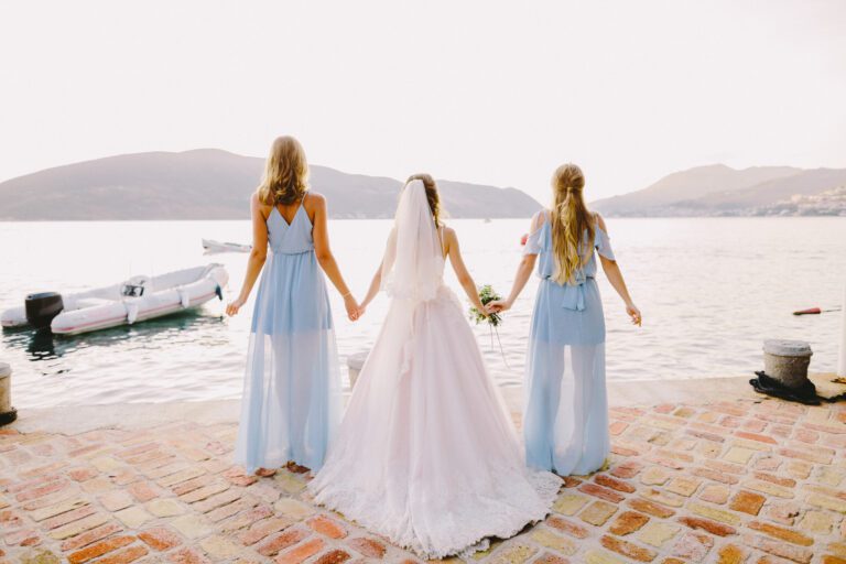 bridesmaids and bride on beach